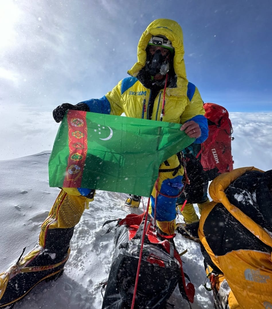 The state flag of Turkmenistan is raised on the top of Chogori