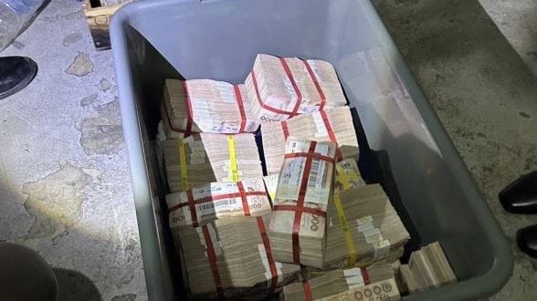 Thai woman finds 12 million baht near trash bin, hands it over to police